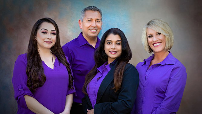 Doctor Sudeep smiling with three other team members at Sunnyvale Family and Cosmetic Dentistry
