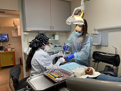 Dentist in Sunnyvale, CA performing emergency dentistry services on a patient